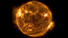 NASA&rsquo;s Solar Dynamics Observatory captured this image of a solar flare &mdash; as seen in the bright flash on the top right &mdash; on Oct. 2, 2022. The image shows a subset of extreme ultraviolet light that highlights the extremely hot material in flares and which is colorized in orange. 